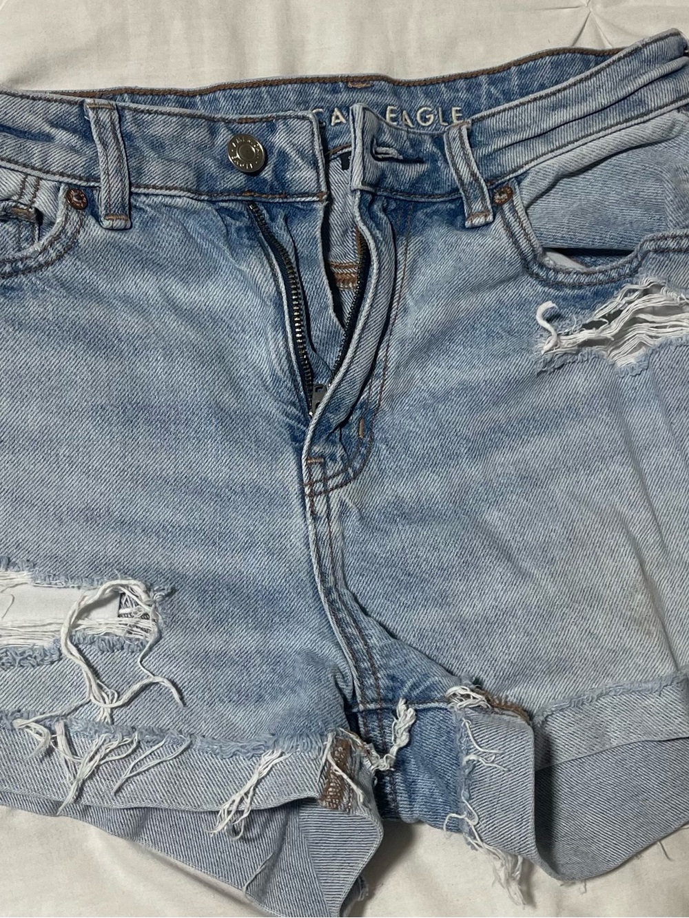 American Eagle Outfitters Light Blue Denim Shorts with Brown Stitching